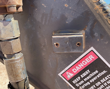 Case Drain Bracket before
