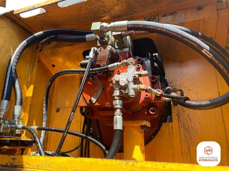 Close-up of hydraulic hoses and fittings on machinery